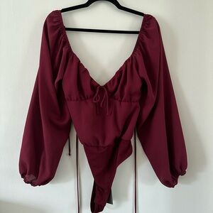 LELIS burgundy long sleeve bodysuit blouse with open back